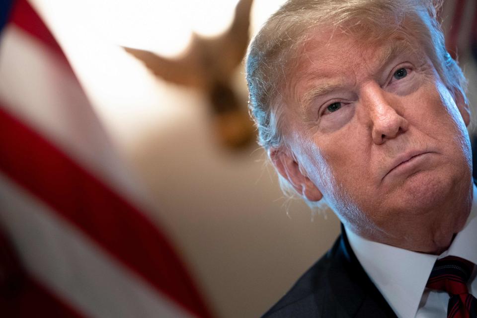 President Donald Trump listens during a meeting on border security in the Cabinet Room of the White House.