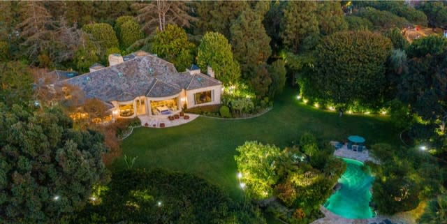 The 2.5-acre estate holds a swimming pool, tennis court and French country-style home built by architect Peter Choate.
