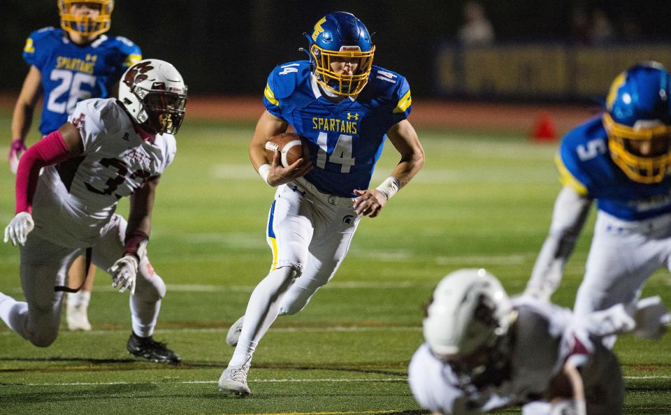 Michael Mancini (14) of the SpartanÕs scores a touchdown in the first half as the Maine-Endwell Spartans beat the Johnson City Wildcats at home with a score of 35-7 in week 7 of Section 4 football on Friday, Oct. 22, 2021. 