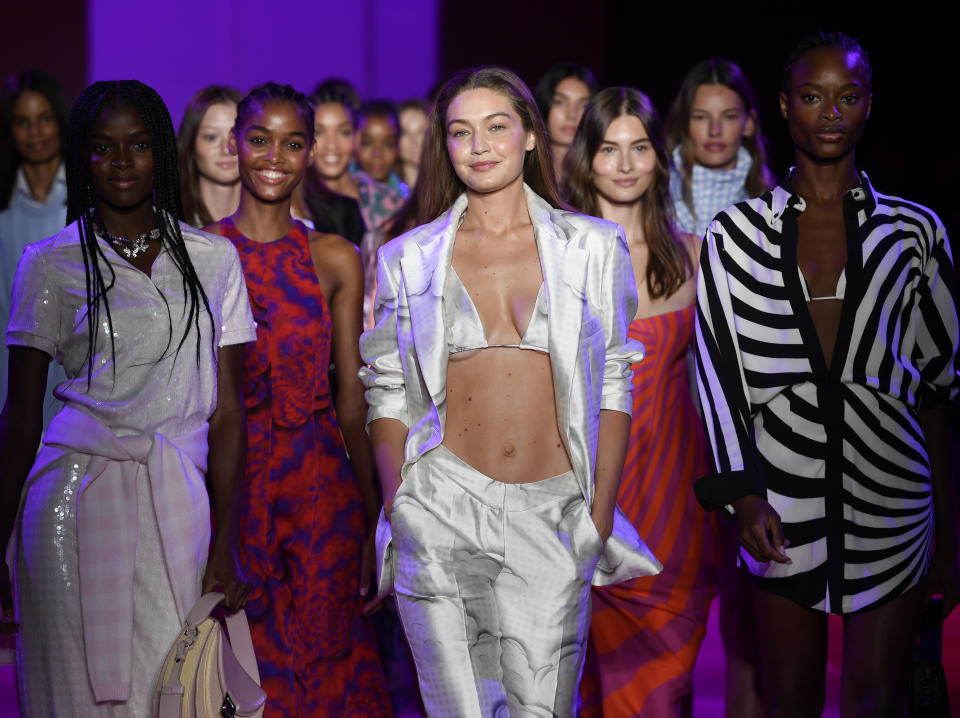 Models, including Gigi Hadid, center, walk the runway during the finale at the Brandon Maxwell spring/summer 2022 fashion show in the Brooklyn borough of New York during Fashion Week on Friday, Sept. 10, 2021. (Photo by Evan Agostini/Invision/AP)