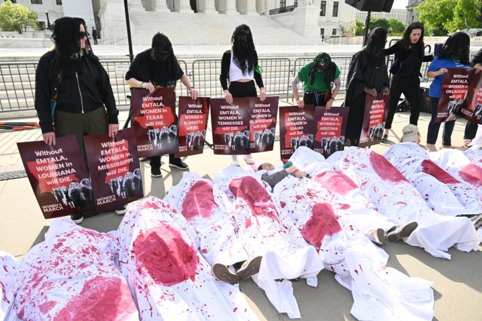 Protesters outside the Supreme Court as justices hear oral arguments over an Idaho law banning abortions in nearly all cases (AFP via Getty Images)