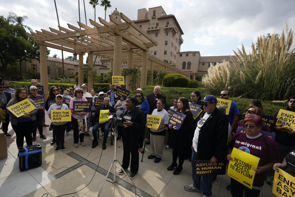 Guerline Jozef, Executive Director of the Haitian Bridge Alliance, speaks in front of demonstrators outside of the Richard H. Chambers U.S. Court of Appeals ahead of an asylum hearing, Tuesday, Nov. 7, 2023, in Pasadena, Calif. (AP Photo/Marcio Jose Sanchez)