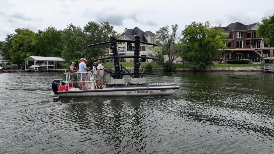 TWRA personnel transport an artificial habitat structure called Tennessee Towers to a location on Old Hickory Lake.