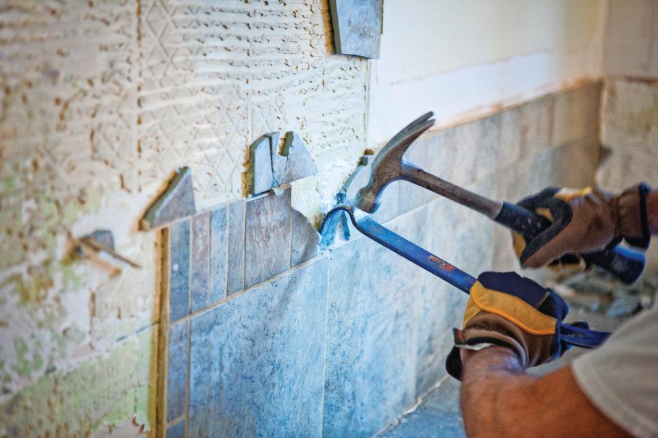 Removing tile is one of the first steps of a backsplash renovation.