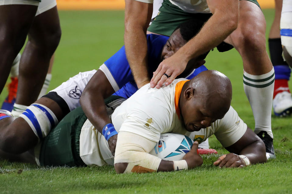 South Africa's Mbongi Mbonambi scores his team's first try during the Rugby World Cup Pool B game at the City of Toyota Stadium between South Africa and Namibia in Toyota City, Japan, Saturday, Sept. 28, 2019. (AP Photo/Christophe Ena)