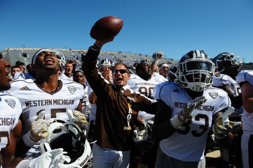 Western Michigan head coach P.J. Fleck and players react after beating Northwestern. (AP Photo/Matt Marton)