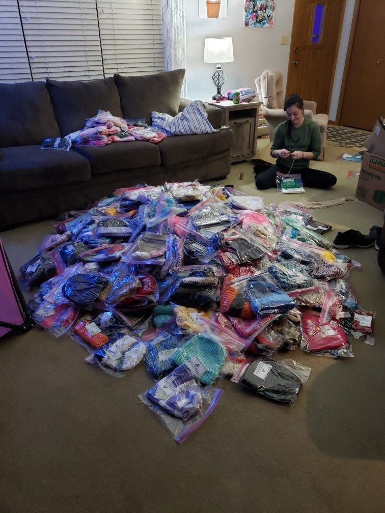 Scott and Kathleen LaBonte have been placing bags with hats, scarves and mittens throughout Sheboygan. For Kathleen, the mountain of bags covering her living room floor was an "eye-opening" moment.