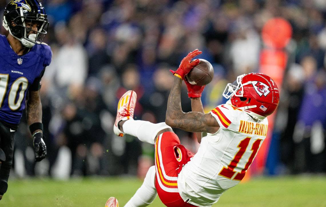 Kansas City Chiefs wide receiver Marquez Valdes-Scantling (11) secures a catch for a first down behind Baltimore Ravens cornerback Arthur Maulet (10) during the AFC Championship Game on Sunday, Jan. 28, 2024, in Baltimore.