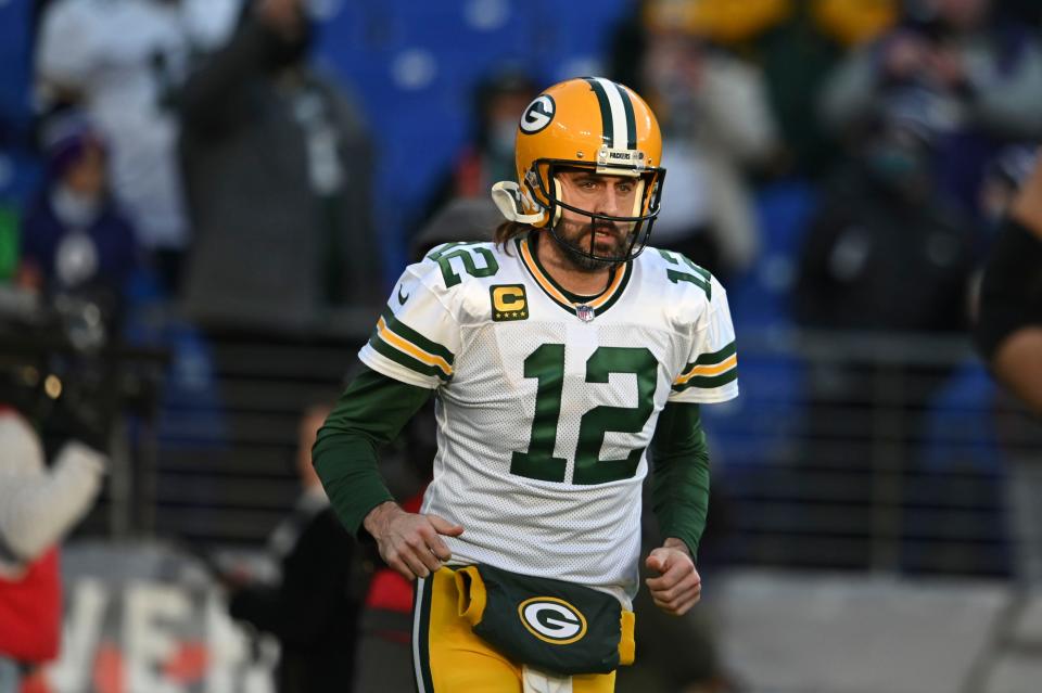 Green Bay Packers quarterback Aaron Rodgers (12) takes the field before the game against the Baltimore Ravens  on Sunday, Dec. 19, 2021, at M&T Bank Stadium in Baltimore.