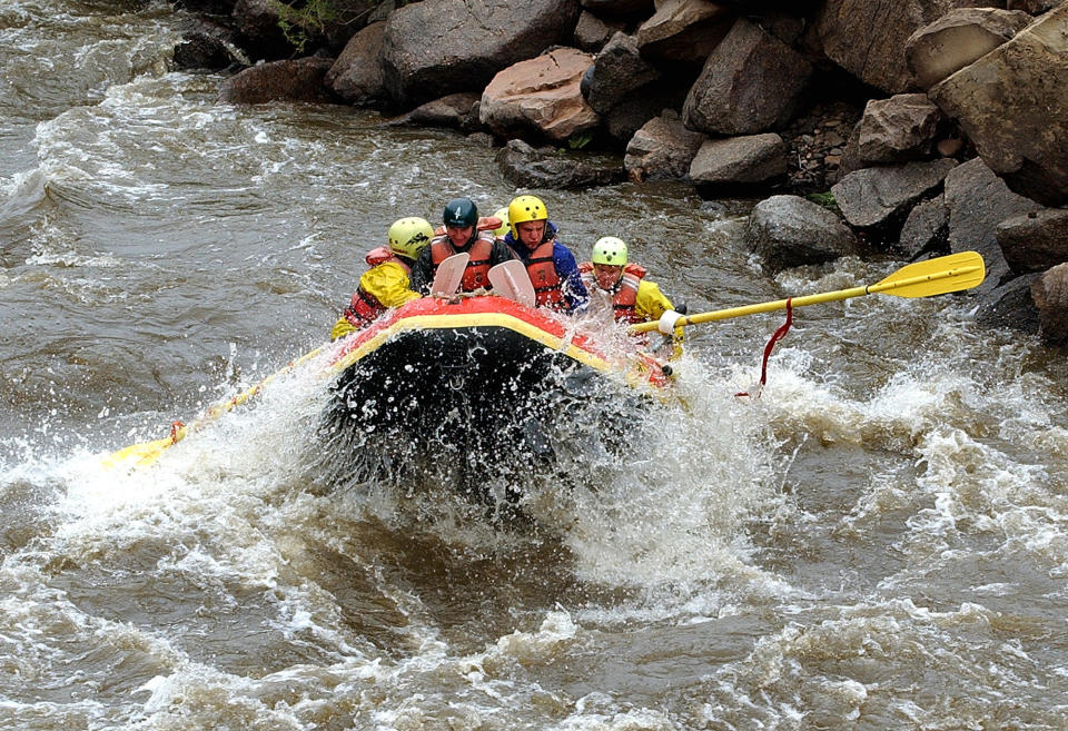 FILE -- In this July 12, 2001, file photo, rafters ride the white waters of the Colorado River during a rafting trip in Glenwood Canyon near Glenwood Springs, Colo. After a winter of historically low snowpack combined with an earlier-than-normal runoff, Colorado river guides and tourists are adjusting their spring and summer plans for what is turning out to be an early paddling season. (AP Photo/Ed Andrieski, File)