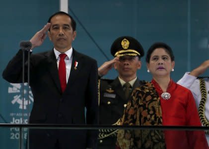 2018 Asian Games – Opening ceremony - GBK Main Stadium – Jakarta, Indonesia – August 18, 2018 – Indonesia's President Joko Widodo and his wife Iriana Widodo attend the Opening Ceremony. REUTERS/Cathal McNaughton