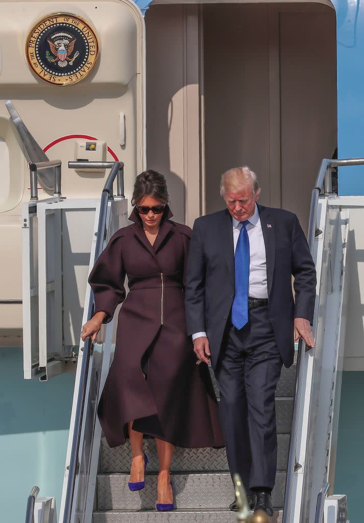 <p>Her plum coat, designed by Jesus Delpozo, <a href="http://www.insideedition.com/melania-trump-makes-waves-she-flaunts-daring-coats-shoes-and-dresses-asia-tour-37894" rel="nofollow noopener" target="_blank" data-ylk="slk:retails for $4,100;elm:context_link;itc:0;sec:content-canvas" class="link ">retails for $4,100</a>.</p>
