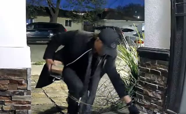 <p>Redwood City Police Department</p> Footage of the alleged porch thief