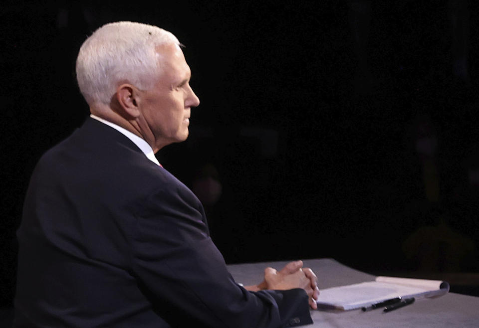 A fly lands on the head of Vice President Mike Pence during the vice presidential debate Wednesday, Oct. 7, 2020, at Kingsbury Hall on the campus of the University of Utah in Salt Lake City. (Justin Sullivan/Pool via AP)