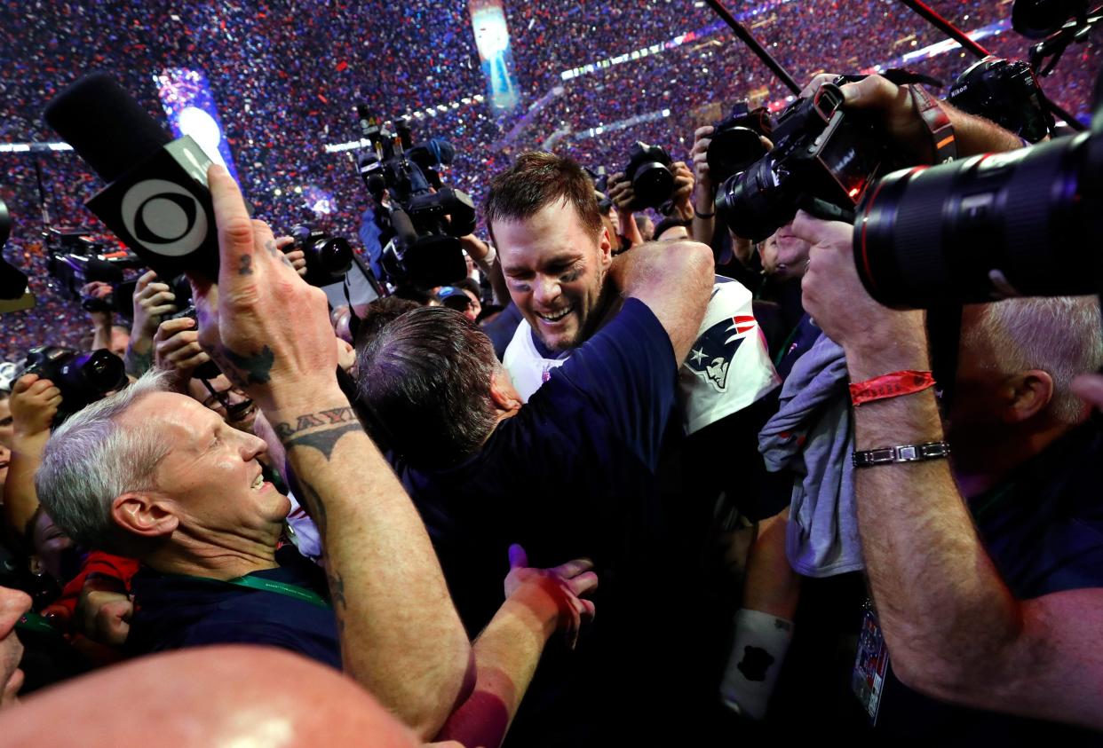 Quarterback Tom Brady celebrates with Patriots head coach Bill Belichick they had defeated the Los Angeles Rams, 13-3, in Super Bowl LIII at Mercedes-Benz Stadium in Atlanta.