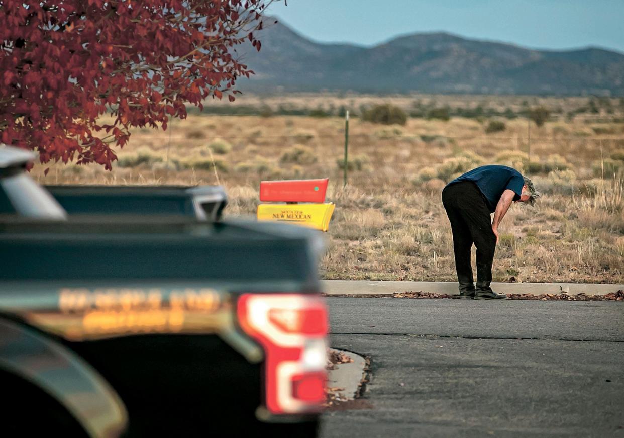 A distraught Alec Baldwin lingers in the parking lot outside the Santa Fe County Sheriff's Office in New Mexico, after he was questioned about a shooting on the set of the film "Rust."
