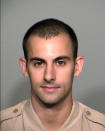 A photo provided by the Las Vegas Metropolitan Police Department shows officer Shay Kellin Mikalonis. Edgar Samaniego, accused of shooting and critically wounding Mikalonis, is to remain jailed pending arraignment Friday, June 5, 2020, on attempted murder and weapon charges, the man's public defense lawyer said. Mikalonis, 29, underwent surgery for spine and head injuries after being hit in the back of the neck June 1 by a gunshot that officials say was fired from across Las Vegas Boulevard during a nighttime protest over the May 25 death of a black man in police custody in Minneapolis. (Las Vegas Metropolitan Police Department via AP)