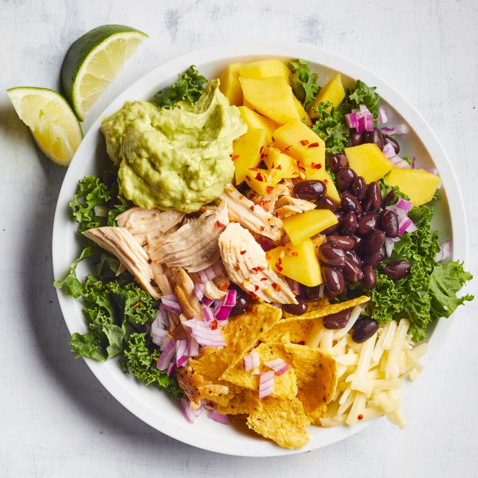 <p>This healthy, super-fast salad recipe swaps out romaine for kale, giving you more than 10 times the vitamin C. Easy flavor hacks like store-bought ranch and pickled jalapeños help make a creamy, tangy and spicy dressing you'll want to drizzle on everything from salad to sliced veggies and shredded poached chicken. <a href="https://www.eatingwell.com/recipe/265716/chicken-kale-taco-salad-with-jalapeno-avocado-ranch/" rel="nofollow noopener" target="_blank" data-ylk="slk:View Recipe;elm:context_link;itc:0;sec:content-canvas" class="link ">View Recipe</a></p>