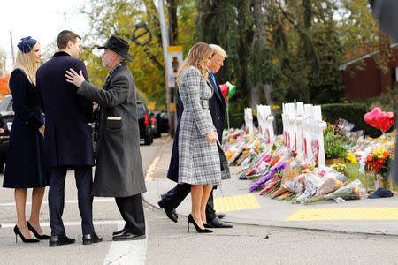 White House senior advisers Jerod Kushner and Ivanka Trump speak with Rabbi Jeffrey Myers as U.S. President Donald Trump and first lady Melania Trump pay their respects outside the Tree of Life synagogue in the wake of the shooting at the synagogue where 11 people were killed and six people were wounded in Pittsburgh, Pennsylvania, U.S., October 30, 2018. REUTERS/Kevin Lamarque