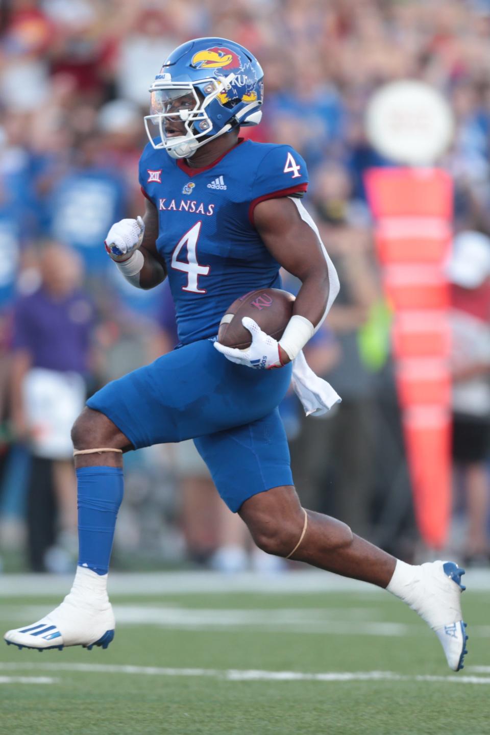 Kansas sophomore running back Devin Neal (4) runs the ball in for a touchdown against Tennessee Tech during the first half of Friday's game at David Booth Kansas Memorial Stadium.