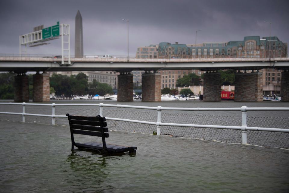 A park bench sits under water in East Potomac Park in Washington, DC on July 8, 2019, after a storm caused flooding. (Photo: Jim Watson/AFP/Getty Images)