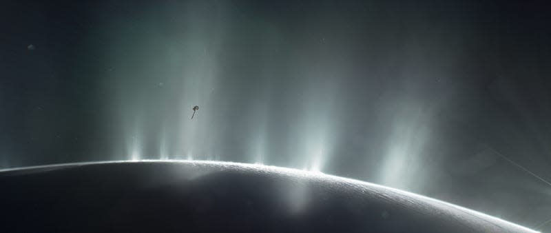 Artist’s depiction of the Cassini probe traveling through the geysers shooting up from Enceladus. 