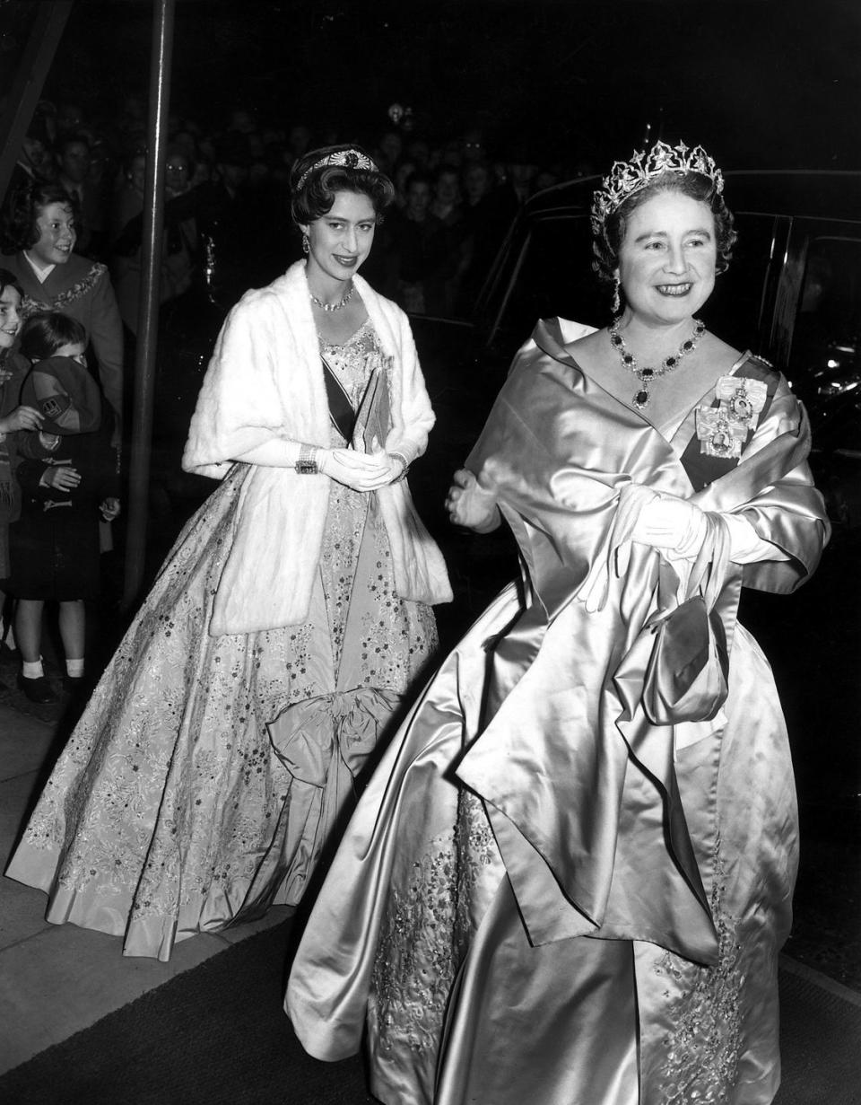 <p>The true origins of Queen Mary's Sapphire Bandeau Tiara, seen here on Princess Margaret in 1958 attending a state banquet with the Queen Mother (who seemed to have borrowed Queen Elizabeth's George VI Demi-Parure for the occasion), are unknown. Some believe it came from the collection of Empress Marie Feodorovna while others contend Queen Mary had it commissioned herself. Though this tiara, whose center sapphire stone could be removed and switched out for other gems, looks very much like the <a href="https://www.townandcountrymag.com/style/jewelry-and-watches/a20756656/queen-mary-diamond-bandeau-tiara-meghan-markle-royal-wedding/" rel="nofollow noopener" target="_blank" data-ylk="slk:Queen Mary Diamond Bandeau Tiara;elm:context_link;itc:0;sec:content-canvas" class="link ">Queen Mary Diamond Bandeau Tiara</a> that Meghan Markle borrowed for her 2018 wedding to Prince Harry, they aren't the same piece. It's unclear what became of the Sapphire Bandeau.</p>