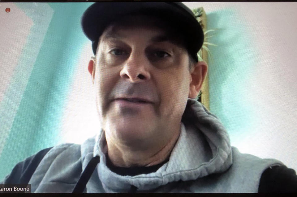 This screengrab from a Zoom call, Friday, March 5, 2021, shows New York Yankees manager Aaron Boone. Boone said he's feeling better after getting a pacemaker and said he hopes to return to the team Saturday or Sunday. (AP Photo/Ron Blum)