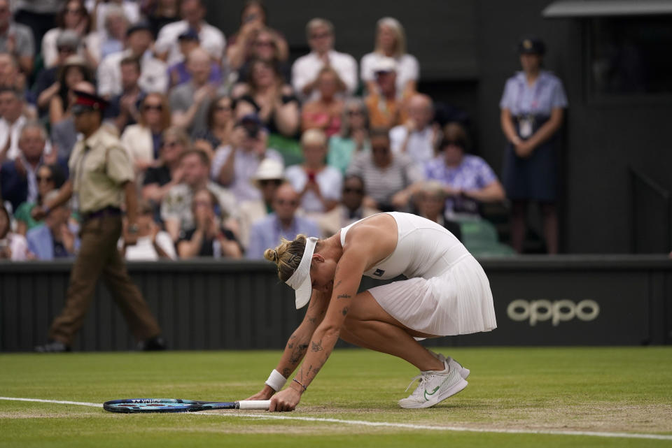 Czech Republic's Marketa Vondrousova returns to Ukraine's Elina Svitolina in a women's singles semifinal match on day eleven of the Wimbledon tennis championships in London, Thursday, July 13, 2023. (AP Photo/Alberto Pezzali)