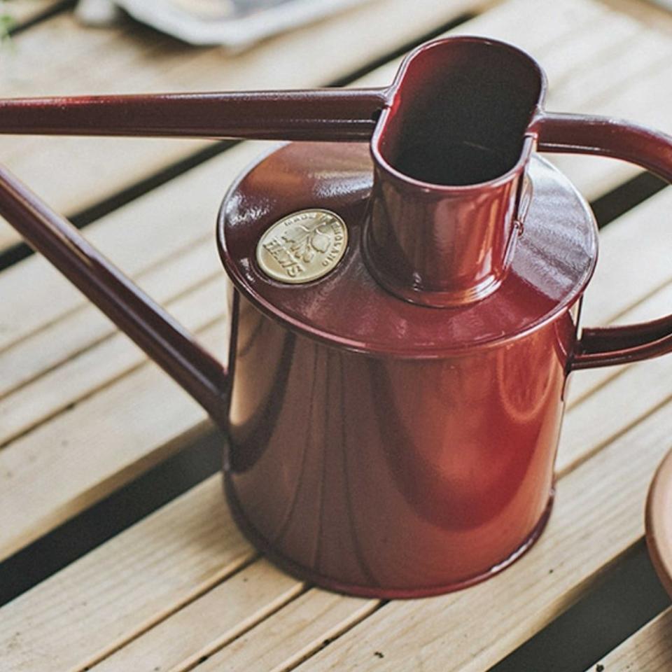 <p><a href="https://www.gardenheir.com/watering-cans/haws-england-1-liter-metal-watering-can-in-burgundy" rel="nofollow noopener" target="_blank" data-ylk="slk:Shop Now;elm:context_link;itc:0;sec:content-canvas" class="link ">Shop Now</a></p><p>Haws England 1 Liter Metal Watering Can in Burgundy</p><p>gardenheir.com</p><p>$98.00</p>