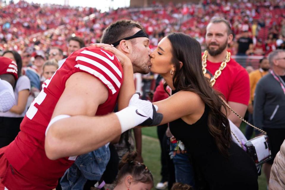San Francisco 49ers fullback Kyle Juszczyk kisses his wife, Kristin Juszczyk, before the New Orleans Saints game in November. Kyle Terada/USA TODAY NETWORK