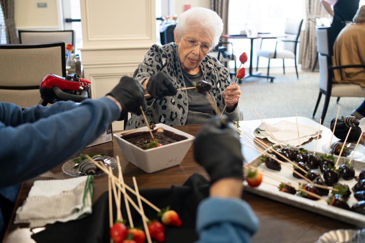 Sandy Young, 87, makes chocolate strawberries during a heart healthy cooking demonstration at StoryPoint Gahanna. The retirement community received the highest resident satisfaction rating in Franklin County on a state survey of long-term care facilities.