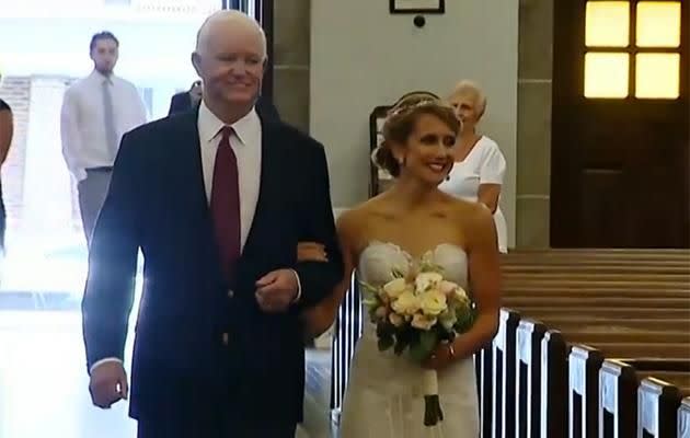 Arthur Thomas walks Jeni down the aisle. Photo: ABC