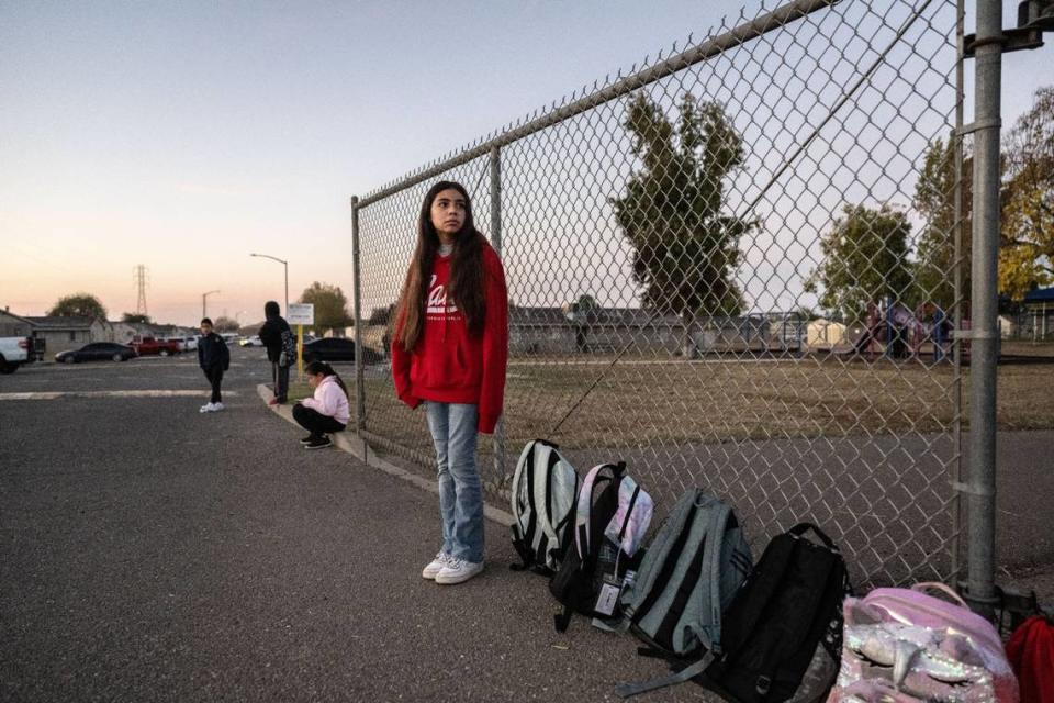 Karla Acevedo Perez, 11, waits for the school bus at the Lodi migrant center on Oct. 29, 2023. Karla will have to leave her school when she returns to Mexico after the center closes for the winter.