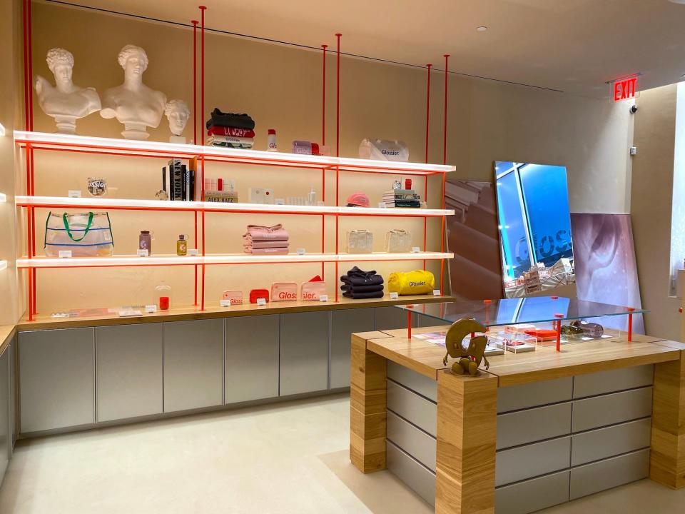 A room of merchandise at Glossier's SoHo store.