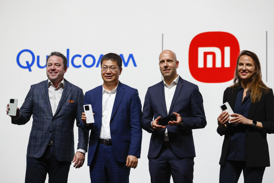 From left to right: Jim Cathey, chief commercial officer of Qualcomm Technologies, Lu Weibing, Xiaomi general manager, Marius Eschhewiler, vice president business Unite Mobile Leica Camera and Shimrit Ben-Yair, vice president of Google Photos and Google one, pose during the presentation of new models Xiaomi 13 Pro, Xiaomi 13 Lite and Xiaomi 13, ahead of the Mobile World Congress 2023 in Barcelona, Spain, Sunday, Feb. 26, 2023. The four-day show, also known as Mobile World Congress, kicks off Monday in a vast Barcelona conference center. It's the world's biggest and most influential meeting for the mobile tech industry. (AP Photo/Joan Monfort)