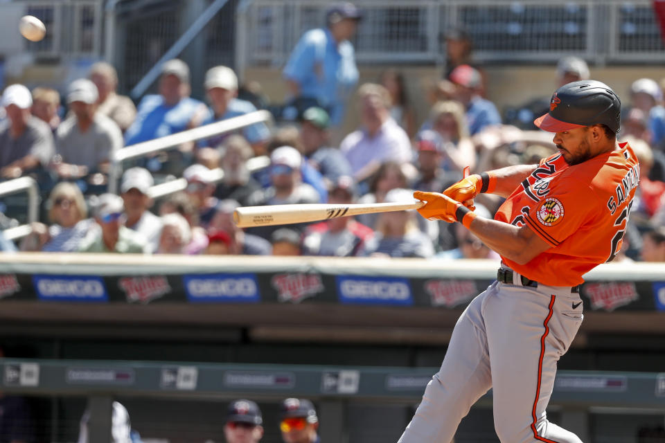 Baltimore Orioles' Anthony Santander hits a solo home run against the Minnesota Twins in the third inning of a baseball game Saturday, July 2, 2022, in Minneapolis. (AP Photo/Bruce Kluckhohn)