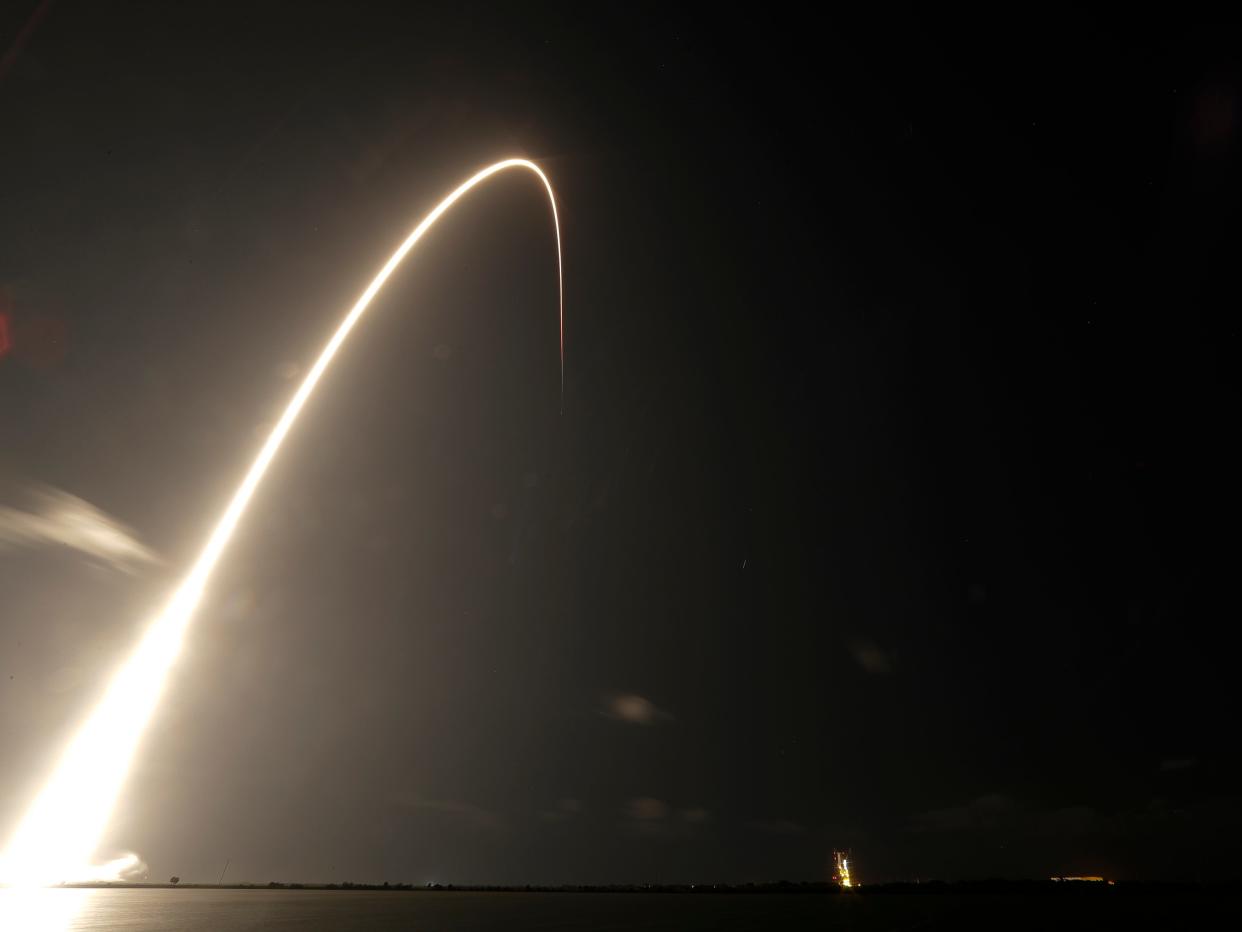 A Falcon 9 SpaceX rocket, with a payload of 60 satellites for SpaceX's Starlink broadband network, lifts off from Space Launch Complex 40 during a time exposure at the Cape Canaveral Air Force Station in Cape Canaveral, Fla., Thursday, May 23, 2019. (AP Photo/John Raoux)