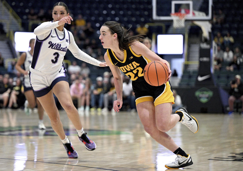 Caitlin Clark (22) tries to get around Kansas State defender Jaelyn Glenn (3) during the final game of the NCAA college basketball Gulf Coast Showcase, Sunday, Nov. 26, 2023, in Estero, Fla. (AP Photo/Chris Tilley)