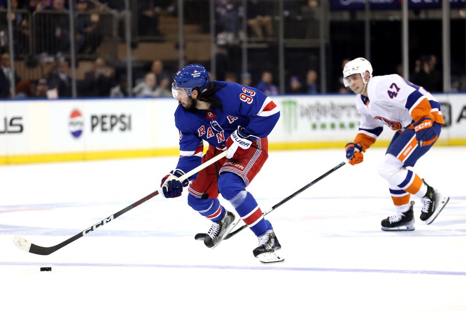 NEW YORK, NEW YORK - SEPTEMBER 24: Mika Zibanejad #93 of the New York Rangers handles the puck against the New York Islanders during the second period at Madison Square Garden on September 24, 2024 in New York City.