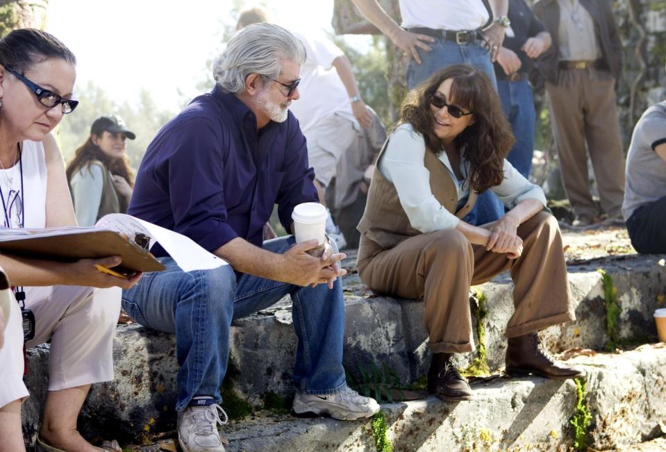 George Lucas and Karen Allen on the set of “Indiana Jones and the Kingdom of the Crystal Skull” - Credit: ©Paramount/Courtesy Everett Collection