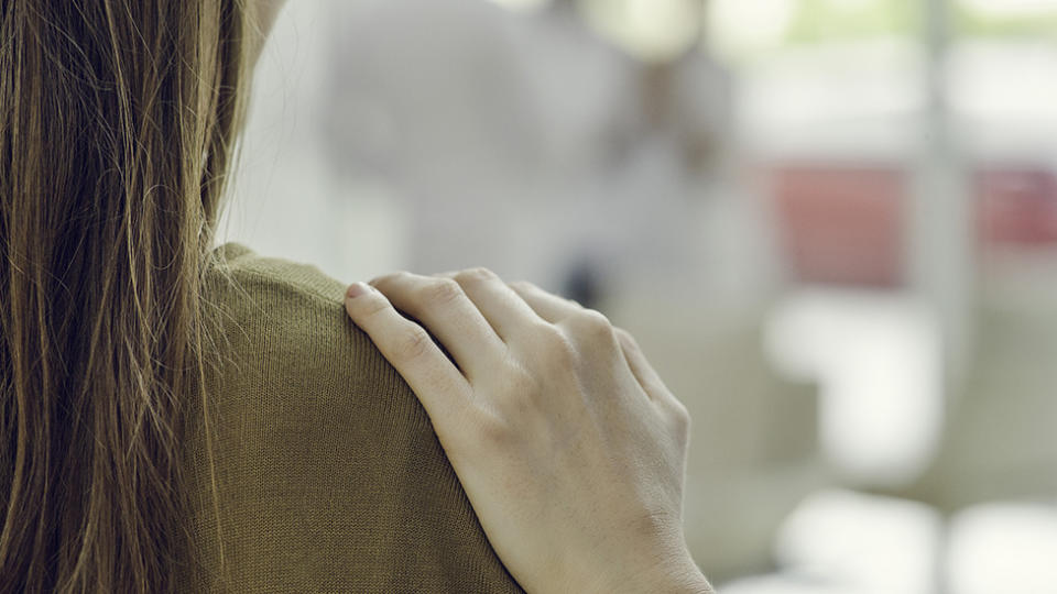 Hand on shoulder represents 'are you ok' mental health conversation