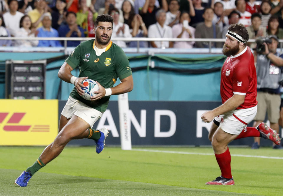 South Africa's Damian de Allende runs into score a try during the Rugby World Cup Pool B game at Kobe Misaki Stadium between South Africa and Canada in Kobe, Japan, Tuesday, Oct. 8, 2019. (Kyodo News via AP)/Kyodo News via AP)