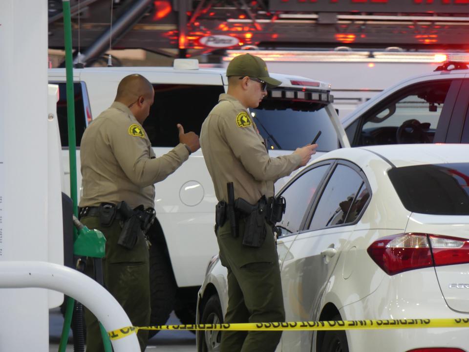 San Bernardino County sheriff's deputies investigate the scene of a shooting at Apple Valley Road and Yucca Loma Road in Apple Valley on Tuesday, April 16, 2024.