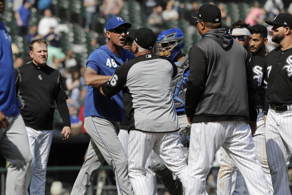 Kansas City Royals bench coach Dale Sveum (46) and Chicago White Sox manager Rick Renteria shove each other as benches clear after Chicago White Sox's Tim Anderson was hit by a pitch during the sixth inning of a baseball game in Chicago, Wednesday, April 17, 2019. The Royals won 4-3. (AP Photo/Nam Y. Huh)