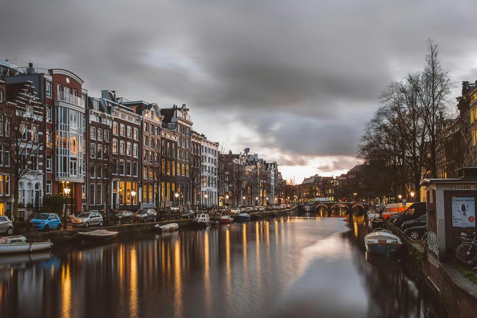 Strolling Amsterdam’s canals is a wonderful way to while away a weekend (Azhar J/Unsplash)