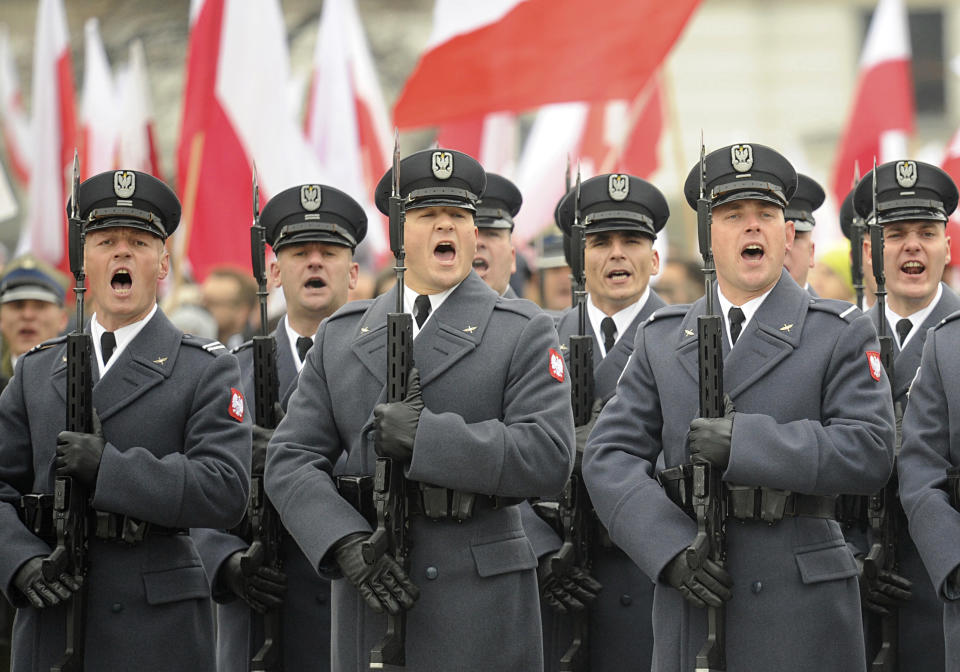 Polish Army soldiers salute during the official ceremony marking Poland's Independence Day, in Warsaw, Poland, Sunday, Nov. 11, 2018. The Independence Day in Poland celebrates the nation regaining its sovereignty at the end of World War I after being wiped off the map for more than a century. (AP Photo/Alik Keplicz)
