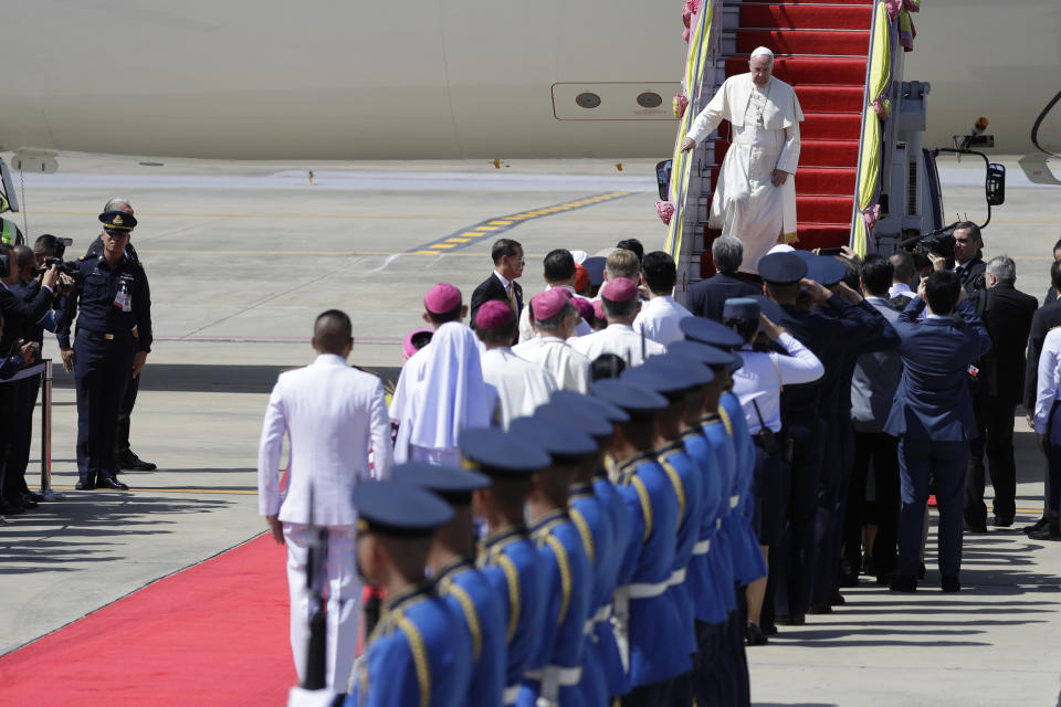 Pope Francis steps down as arrives at Military Air Terminal of Don Muang Airport, Wednesday, Nov. 20, 2019, in Bangkok, Thailand. (AP Photo/Gregorio Borgia)