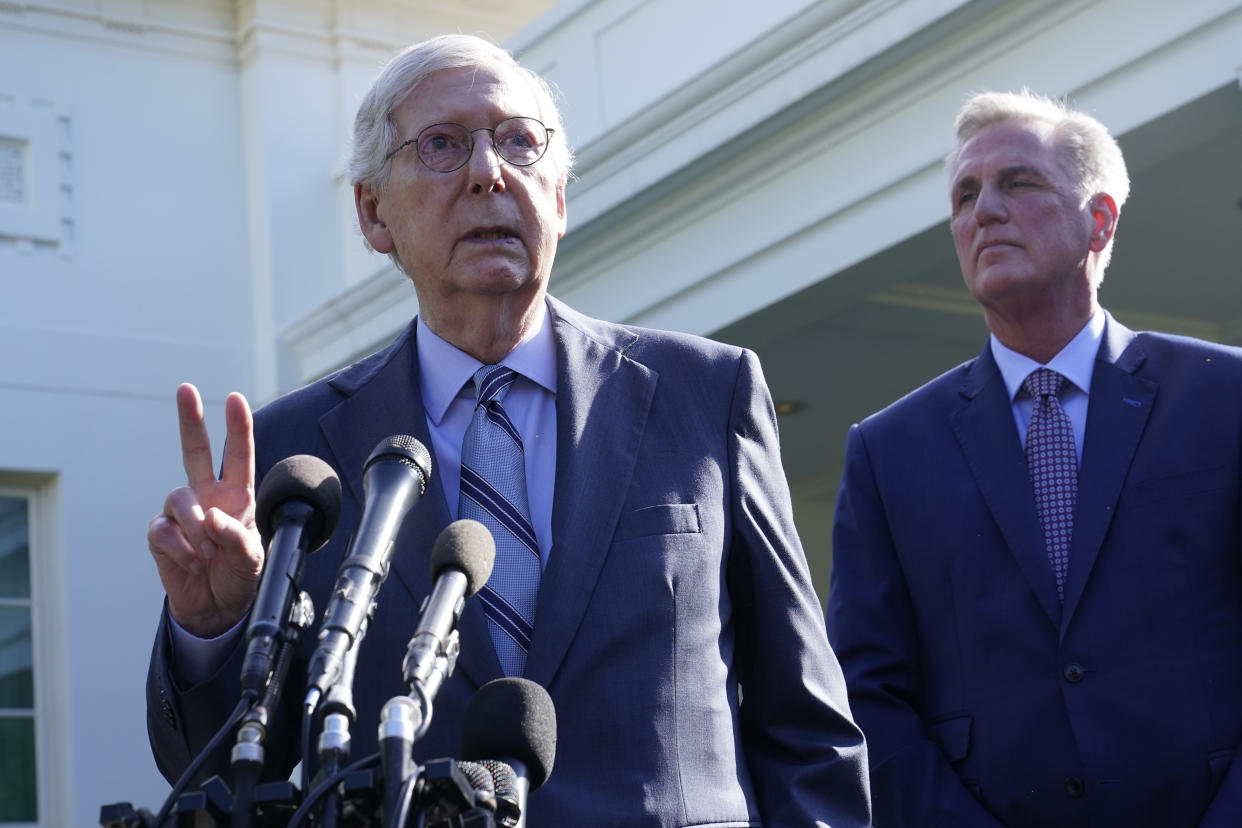 Senate Minority Leader Mitch McConnell of Ky., left, standing with House Speaker Kevin McCarthy of Calif., right, speaks to reporters outside of the West Wing of the White House in Washington, Tuesday, May 9, 2023, following a meeting with President Joe Biden on the debt limit. (AP Photo/Susan Walsh)