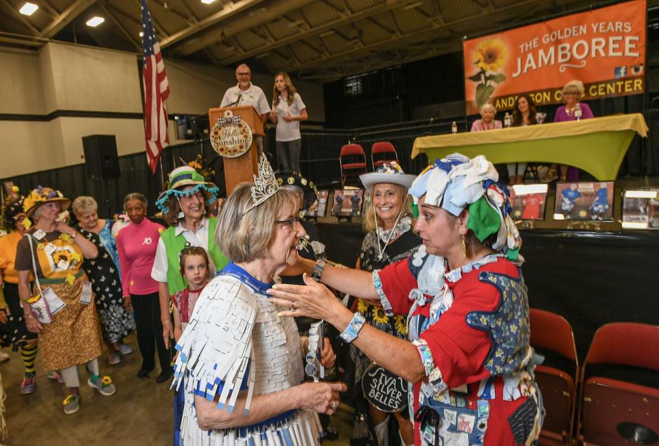 Phyllis Barnette, left, of Brookdale Anderson, is announced as the winner of the Wearable Art Fashion Show and congratulated by Kelly Jo Barnwell, director of seniors at Jo Brown, during the 9th Annual Golden Years Jamboree at the Anderson Sports & Entertainment Complex in Anderson, SC Wednesday, July 17, 2024.